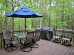 Raised deck with patio table, gas grill, and beautiful wooded views Raised deck with patio table, gas grill, and beautiful wooded views